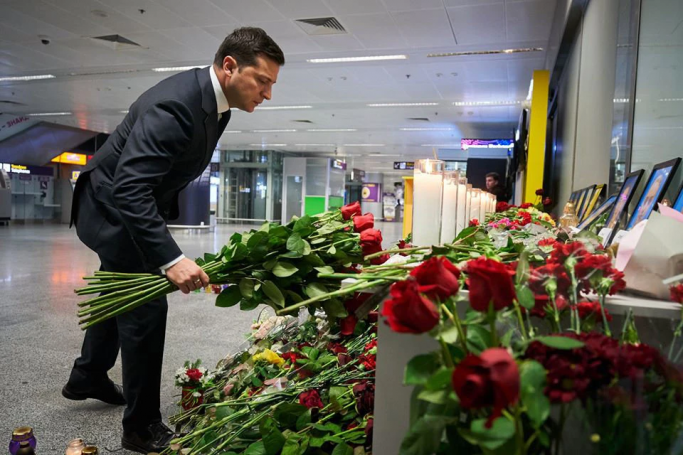 President Volodymyr Zelensky of Ukraine placing flowers at a memorial for the victims of the plane crash at the Boryspil airport on Thursday.Credit. Photo: Ukrainian Presidential Press Service