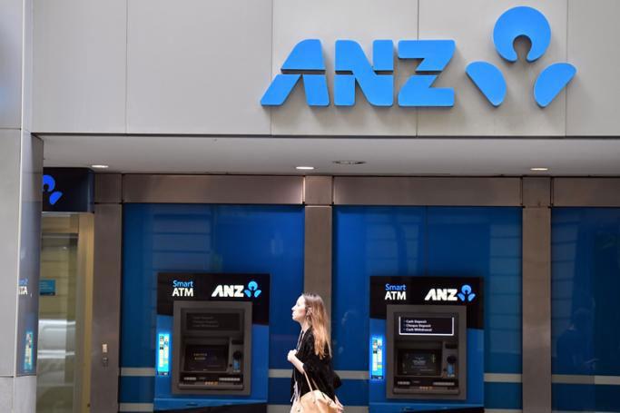 A pedestrian walks past Australia and New Zealand Banking Group Limited (ANZ) automatic teller machines (ATMs) in Sydney, New South Wales, Australia, 16 December 2019. EPA-EFE/MICK TSIKAS AUSTRALIA AND NEW ZEALAND
