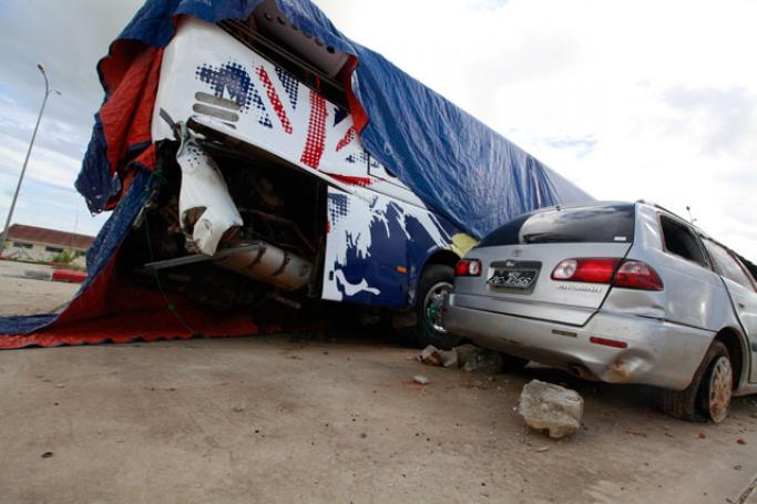 နေပြည်တော်အမြန်လမ်းတွင် မတော်တဆဖြစ်ခဲ့သည့် ယာဉ်များထားရှိရာ နေပြည်တော် မော်တော်ယာဉ် ထိမ်းသိမ်းရေး စခန်းတစ်ခုအား ၂၀၁၄ ခုနှစ်အတွင်းက  တွေ့ရစဉ်။ ဓာတ်ပုံ - ဟောင်ဆာ(ရာမည)