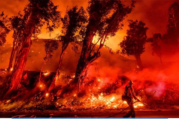 Flames from a backfire consume a hillside as firefighters battle the Maria Fire in Santa Paula, California, November 1, 2019 Source: AAP