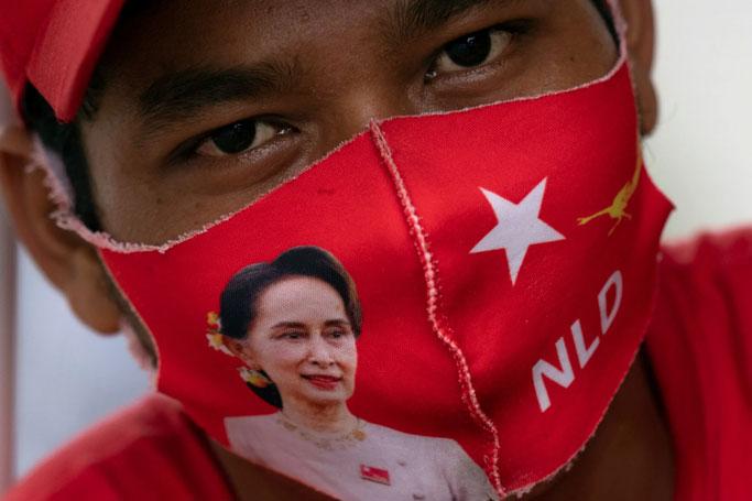 A supporter of the NLD, pictured on Oct. 2 in Yangon: the last thing Myanmar needs is business as usual.   © Reuters