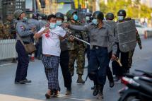 (Photo - Police arrest a protester demonstrating against the military coup in Mandalay on February 15, 2021 /AFP)