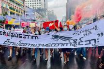 ပုံ - ဇွန်လ ၂၆ ရက် ၊ ရန်ကုန်မြို့ရှိ လူငယ်များ၏ စစ်အာဏာရှင်ဆန့်ကျင်ရေး သပိတ်စစ်ကြောင်းဆန္ဒပြလှုပ်ရှားမှု မြင်ကွင်း(Photo - AFP)