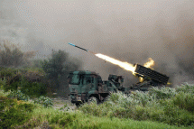 A Thunderbolt 2000 multiple rocket launcher fires munitions during a military exercise in Taichung, Taiwan, in July. | BLOOMBERG
