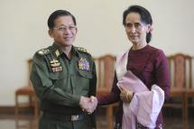  Senior General Min Aung Hlaing, Myanmar Commander In-Chief (L) and National League for Democracy (NLD) party leader Aung San Suu Kyi (R) shake hands after their meeting at the Commander in-Chief's office in Naypyidaw on December 2, 2015. Photo - AFP / PHYO HEIN KYAW