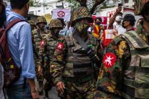 Myanmar soldiers on the march amid an anti-coup protest. Image: Getty via AFP / Hkun Lat