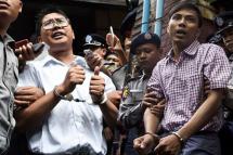JAILED. The two Reuters journalists face 7 years in prison after allegedly obtaining classified documents illegally. Wa Lone photo by Ye Aung Thu/AFP, Kyaw Soe Oo photo by Aung Kyaw Htet/AFP.